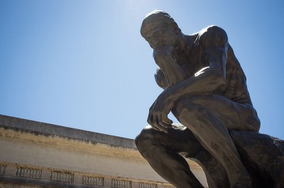 ‘The Thinker’ by Auguste Rodin, at the Legion of Honour, San Fransisco.  This is one of a number of over-life size bronze casts based on the twenty seven inch high original version, made for the Paris exhibition of 1889 (Wikimedia Commons)