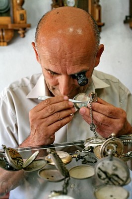 A watchmaker at work.  The watchmaker’s craft uses a degree of fine motor control and hand-eye coordination which is unprecedented in the animal kingdom (Image: Wikimedia Commons)